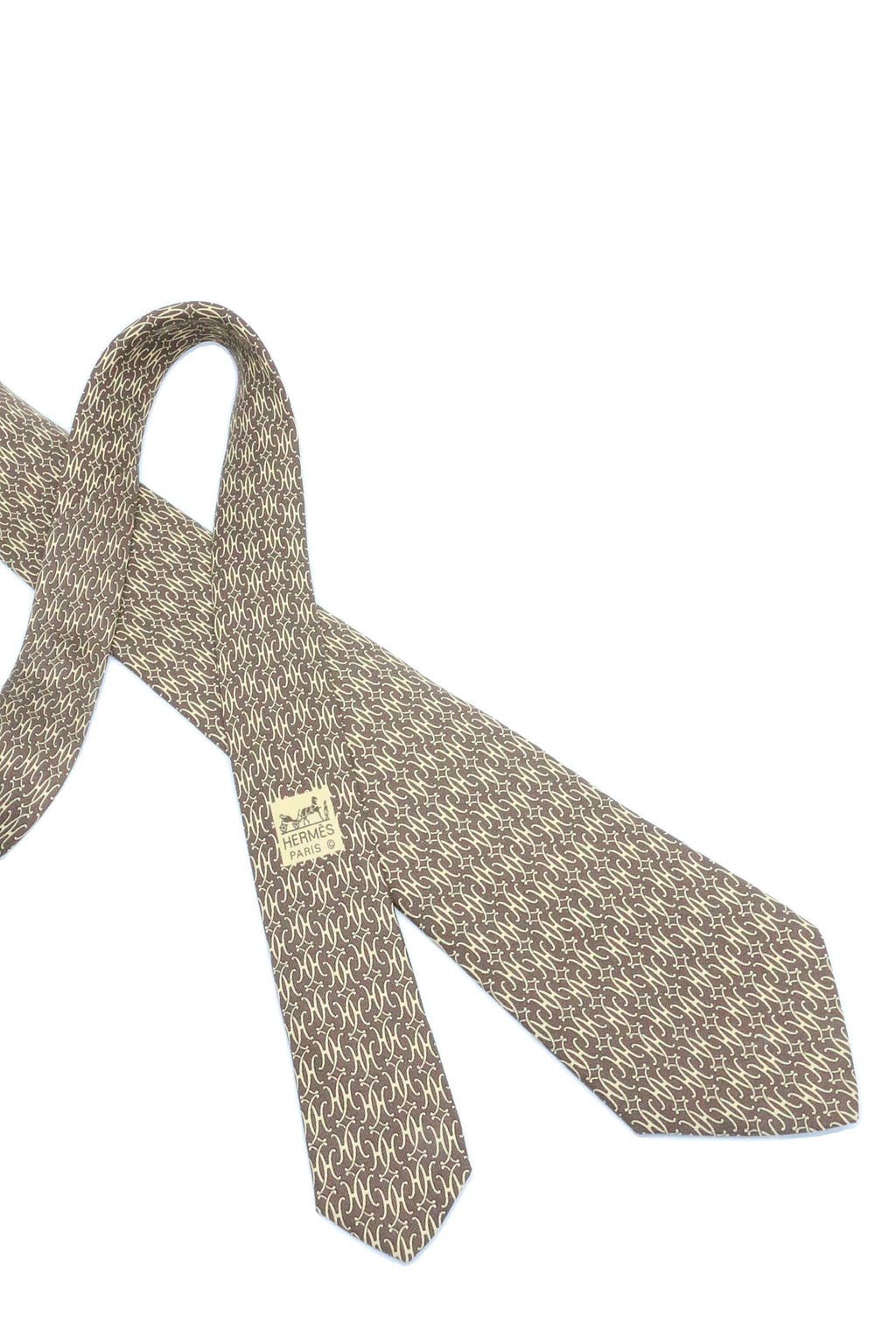 Corbata Hermés café clarito con H amarillas