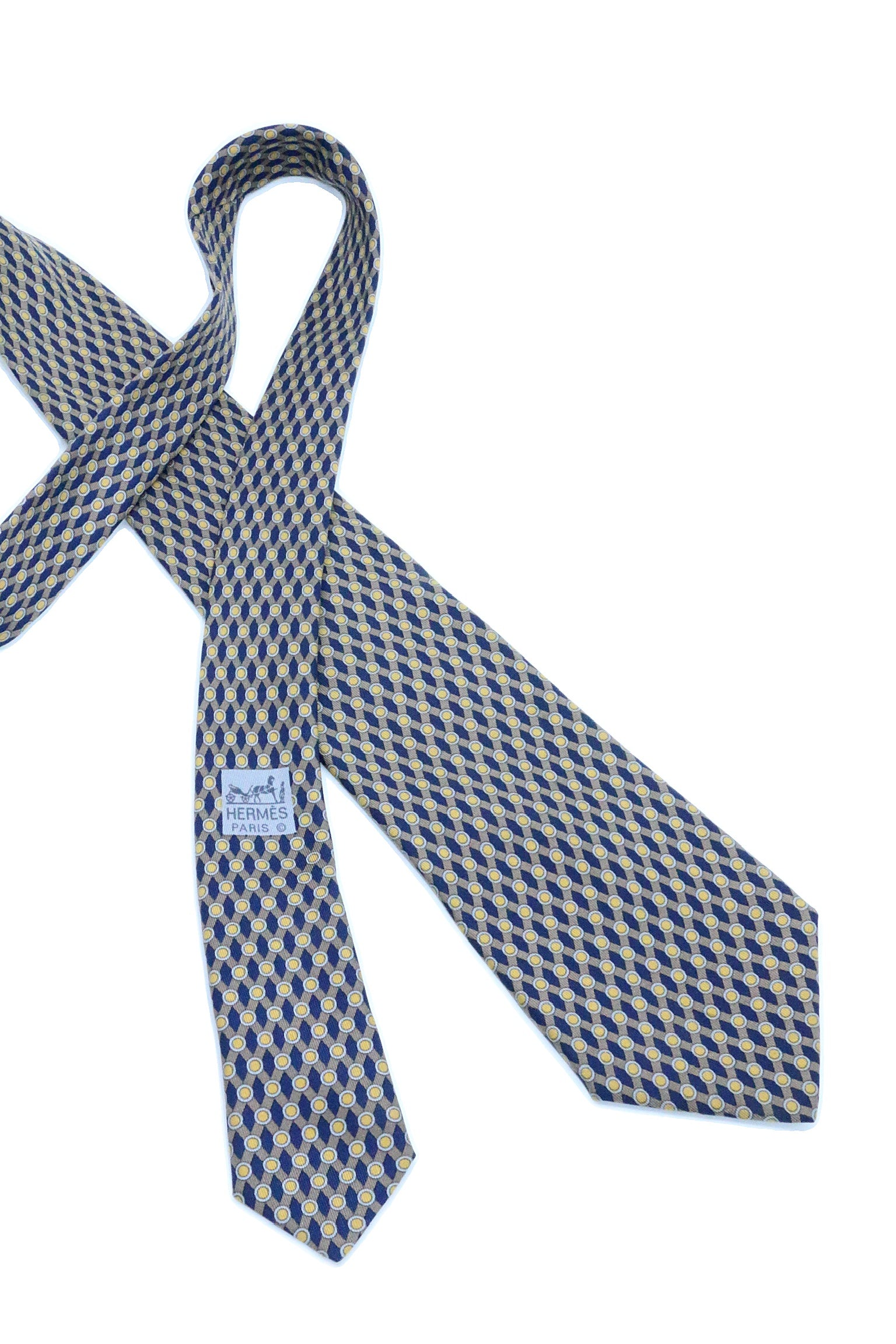 Corbata Hermés azul marino con puntos amarillos