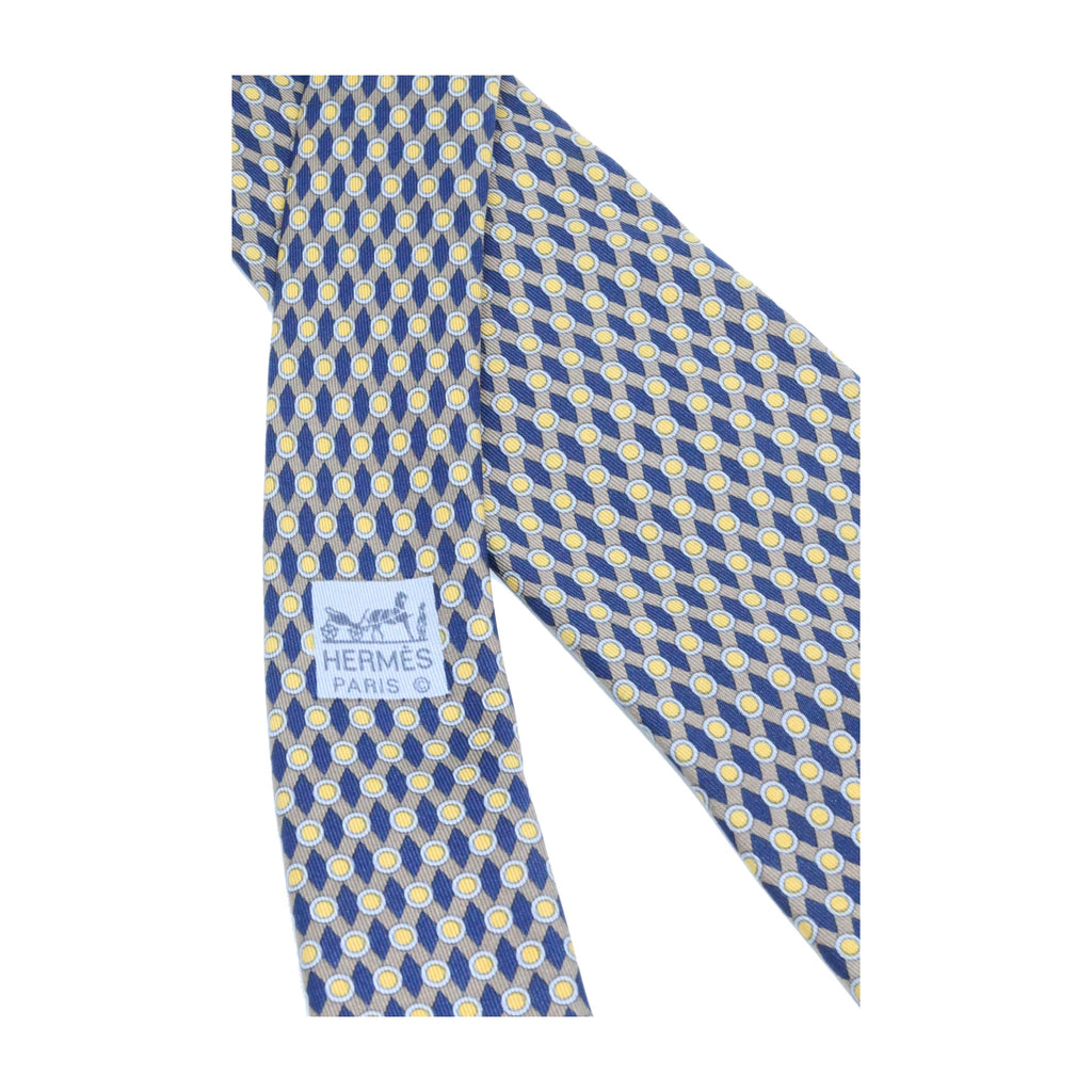 Corbata Hermés azul marino con puntos amarillos