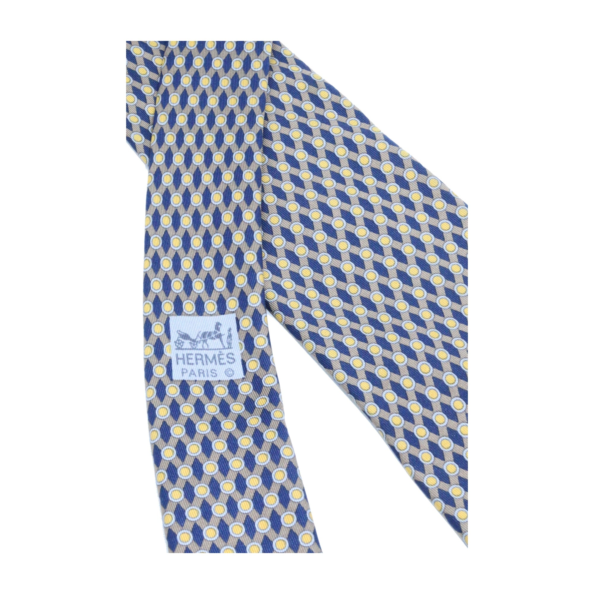 Corbata Hermés azul marino con puntos amarillos