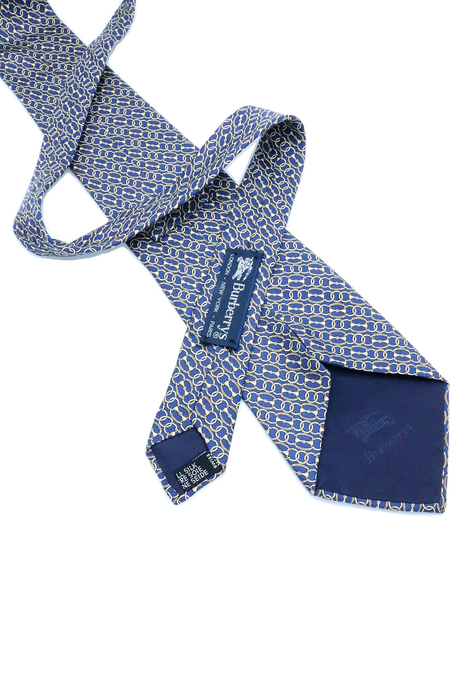 Corbata Burberry azul con círculos dorados
