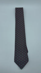 Corbata Hermés verde con cruces rosas
